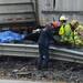 Rescue workers stand near a vehicle that was crushed during an accident on south U.S. 23 north of Six Mile Road in Northfield Township on Monday, March 11, 2013. Melanie Maxwell I AnnArbor.com